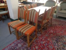 A blonde oak refectory table and six chairs