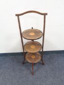 An Edwardian inlaid mahogany cake stand