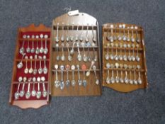 Three wooden teaspoons stands of crested teaspoons