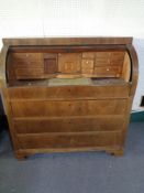 An early 20th century barrel fronted bureau
