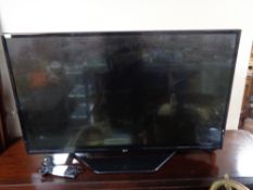 An LG 43 inch lcd tv with lead and remote