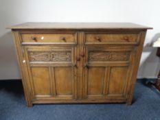A reproduction oak sideboard