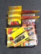 A tray of fourteen boxed die cast vehicles including Shell and Maisto sports car,