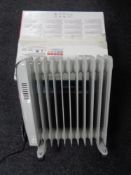 A boxed Canon Pixma printer together with an oil filled radiator