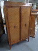 A 20th century mahogany double door cabinet