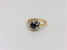 An 18ct gold sapphire and diamond cluster ring, size K CONDITION REPORT: 3.