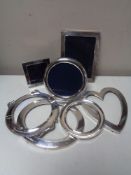 Three silver photograph frames, together with four further silver frame shells.