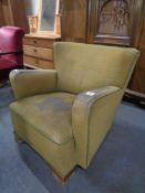 An Edwardian button back armchair