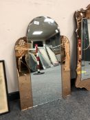 An Art Deco two-tone all glass mirror,
