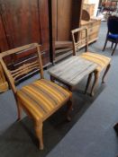 An antique pine side table and a pair of dining chairs