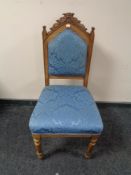 An Edwardian oak hall chair