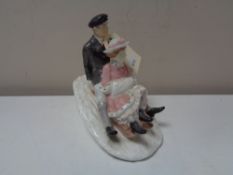 A Coalport figure, Winter Frolic,