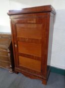 An antique mahogany hall cupboard