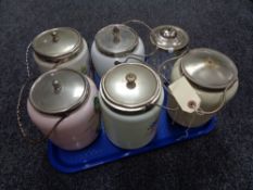 Eight glass lidded biscuit barrels some with hand painted decoration
