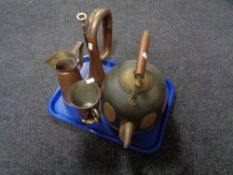 A tray of an Eastern brass and copper teapot, brass and copper tankard,