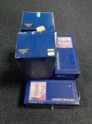 A tray of two boxed Cristal D'arques decanters with stoppers together with five boxed pairs of