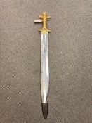 A gilt handled ornamental short sword