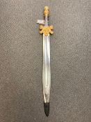 A gilt handled ornamental short sword