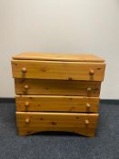 A pine four drawer chest with knob handles