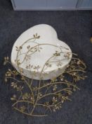 A Next heart shaped footstool and a piece of metal wall art