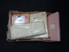 Two boxes of new sealed bedding and leopard print cushions