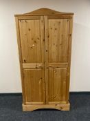 A pine double door wardrobe