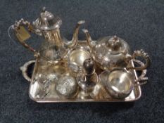 A plated twin handled gallery tray containing three decanter labels,
