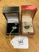 A 9ct white gold dress ring together with two further 9ct gold rings and a 14ct gold pendant on 9ct