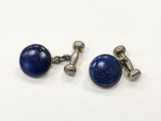 A pair of silver and lapis lazuli cuff links