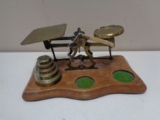 A set of twentieth century brass postal scales and weights