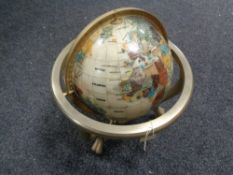 A Gemstone globe on brass stand