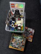 A box of lego and Star wars books