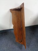 An oak Arts & Crafts wall shelf