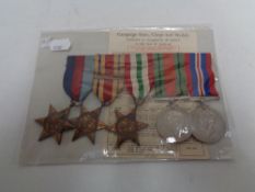 A set of five WW II medals on ribbons