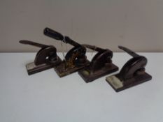 Four vintage desk punches