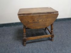 An oak drop leaf coffee table