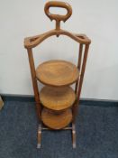 An oak Arts & Crafts three tier cake stand