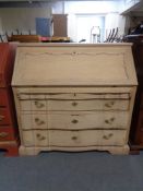 A 20th century blonde oak bureau