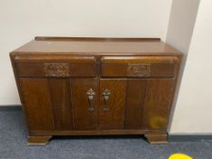 A 20th century oak sideboard