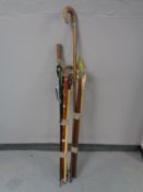 Two bundles of walking sticks, shooting sticks,