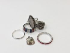 Five silver dress rings and an enamelled Blackpool fob
