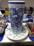 A blue and white stick pot and two ceramic chargers