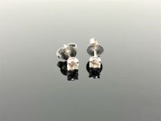 A pair of Tiffany & Co diamond stud earrings, in platinum, approximately 0.