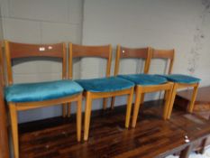 Four mid century teak dining chairs