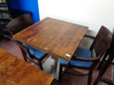 A cafe table together with a pair of wooden chairs (3)