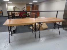 Four wooden folding trestle tables