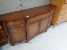 A reproduction mahogany sideboard