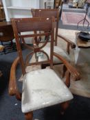 A pair of contemporary carved armchairs