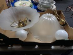 A pair of glass and brass mounted ceiling lights