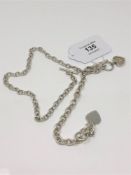 Two silver T-bar chains strung with hearts CONDITION REPORT: 56.